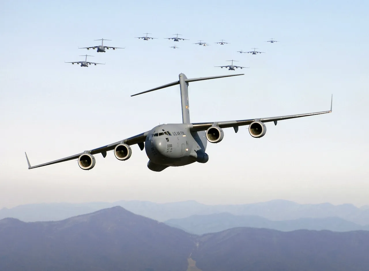 Cargo plane One plane flying with multiple flying in the background